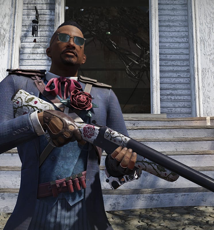 A character in Fallout 76, adorned with a fashionable suit, stands in front of a dilapidated house. They are also wearing sunglasses, and they are holding a shotgun decorated with floral designs and roses.