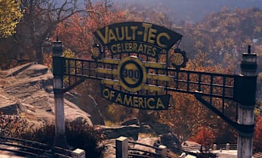 A Vault-Tec of America Celebrates 300 Years sign perched on top of a tree covered mountain