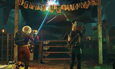 Two player characters fire upon a Vertibird underneath a "Happy Halloween" banner.