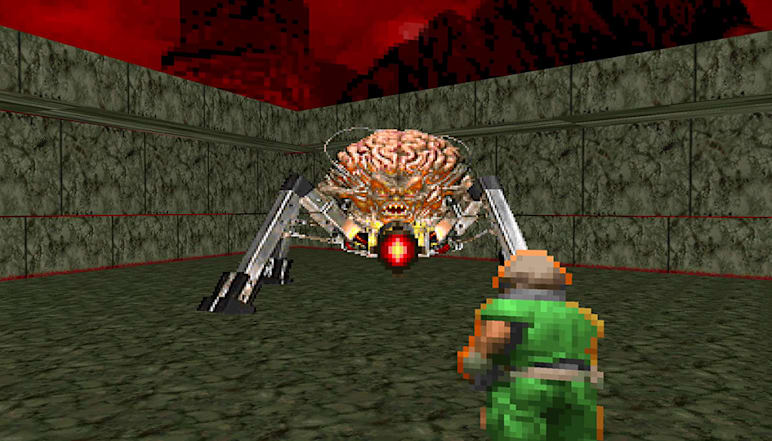 DOOMguy faces against the imposing Spider Mastermind in DOOM (1993)