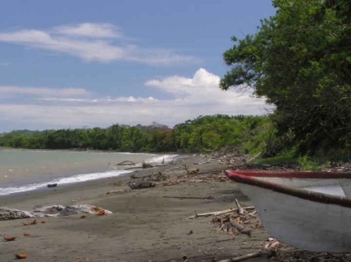 beach with abandoned boat