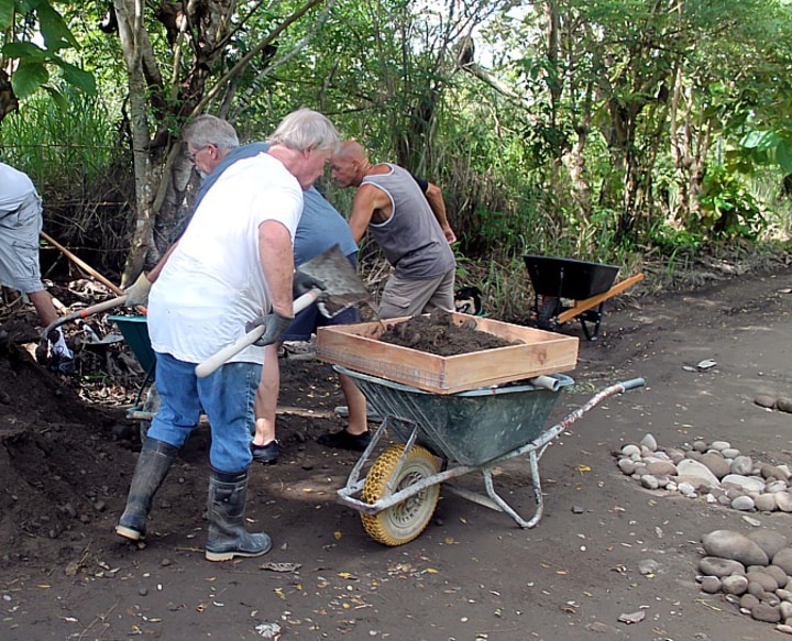 Expat filling wheelbarrow