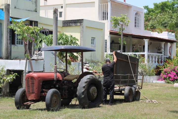 Lalo loading his tractor