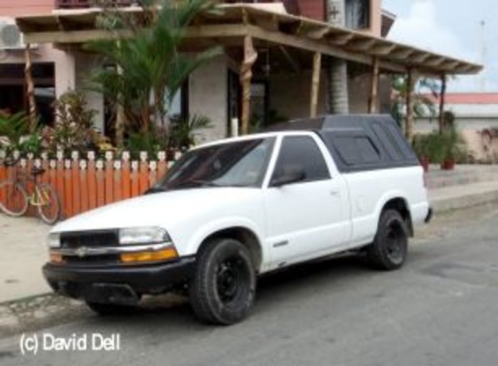 white Chevy S10 truck