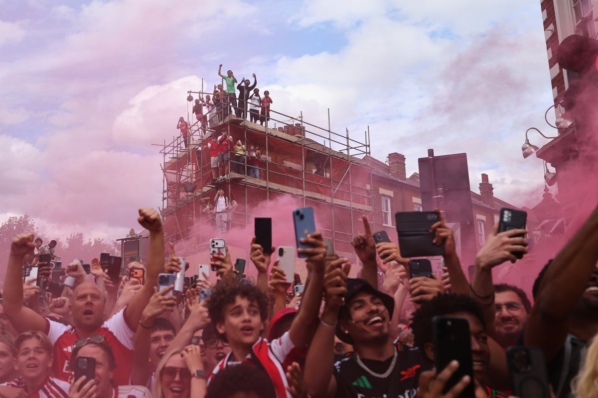 Emergency services rescue fans and police make arrests during Arsenal Premier League parade
