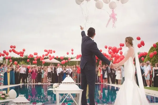 Wedding couple celebrating with their friends