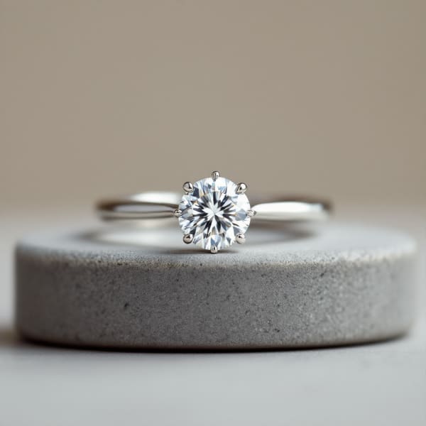 Custom solitaire engagement ring on display