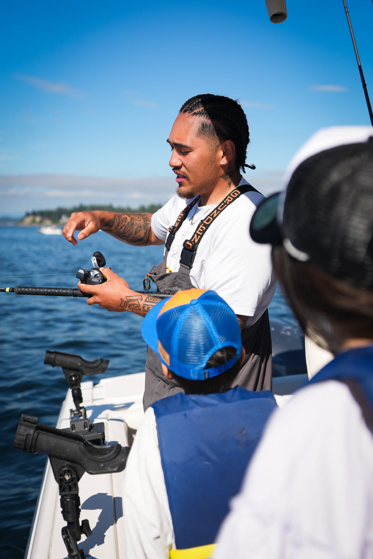 Captain Donovan walks the crew through the mooching technique — rod, reel, feel
