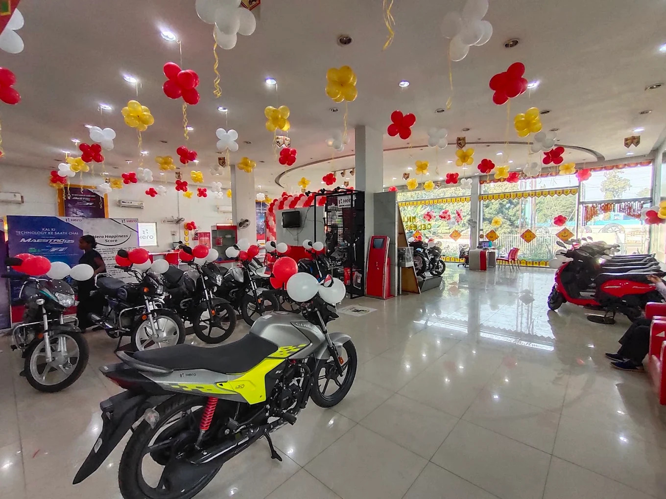 Hero MotoCorp showroom interior showing commuter and performance motorcycles