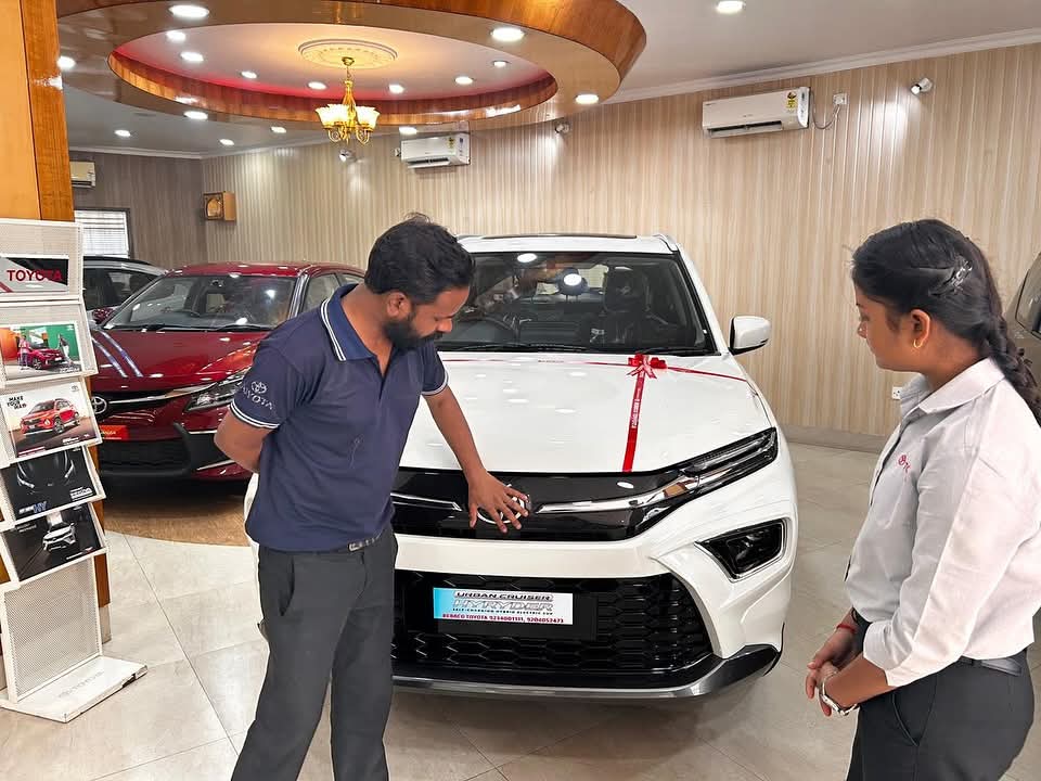 Toyota showroom facility showcasing premium vehicles and customer amenities