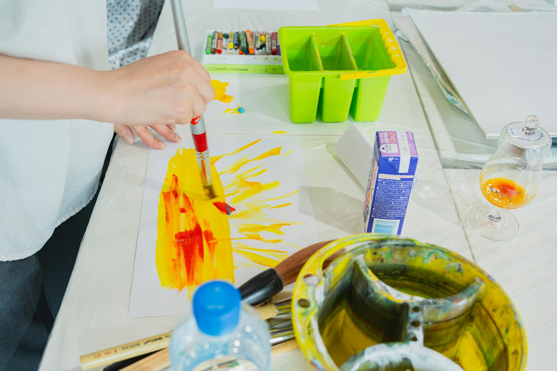 Explore creativity in a Tokyo art class, capturing vibrant brush strokes and colorful palettes.
