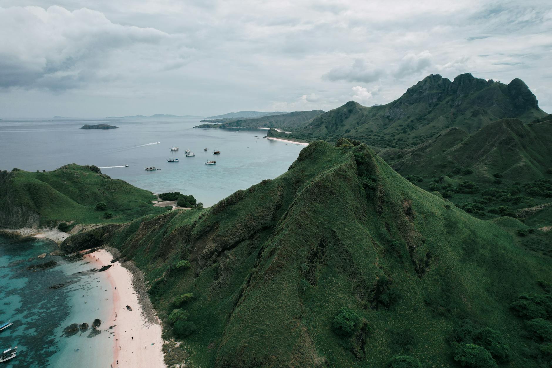 Discover the breathtaking landscape of Padar Island with its unique pink beach and rugged mountains, East Nusa Tenggara.