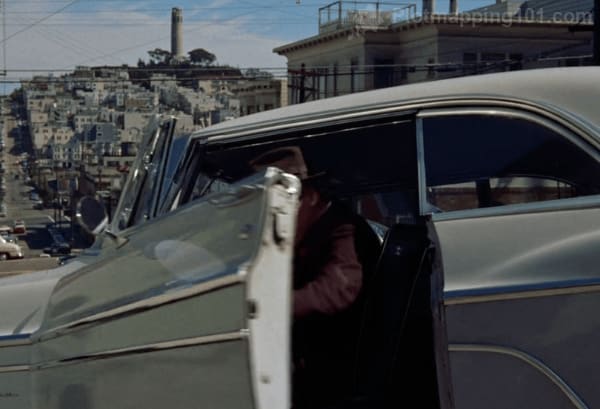 Scottie parks his car in front of his own apartment.