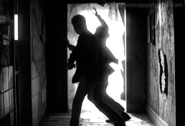 Leonard fist-fighting Lenny in the building.