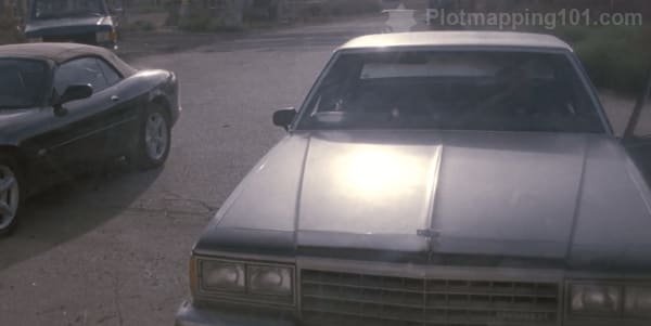 Teddy's car shows up at the abandoned building.