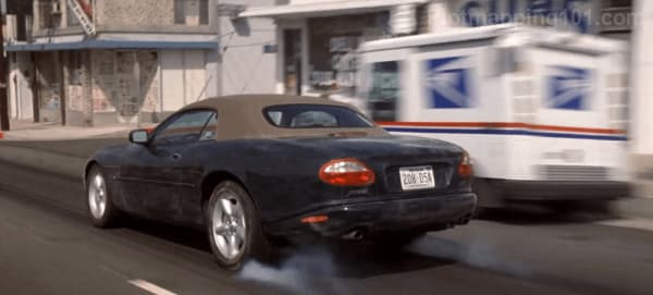 Leonard slams on the brakes in the middle of the street.