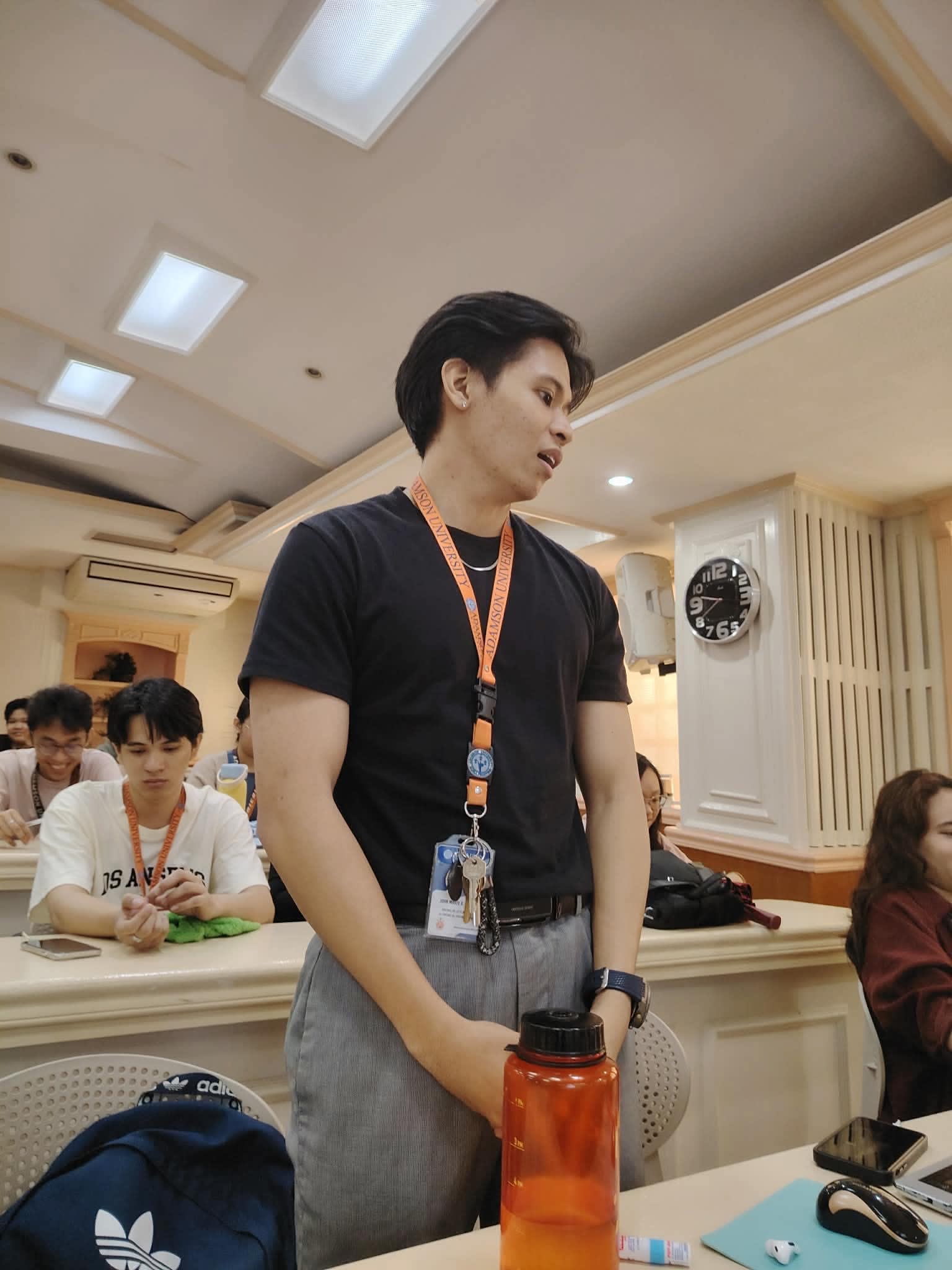 Student participating in NQI Seminar discussion at Adamson University