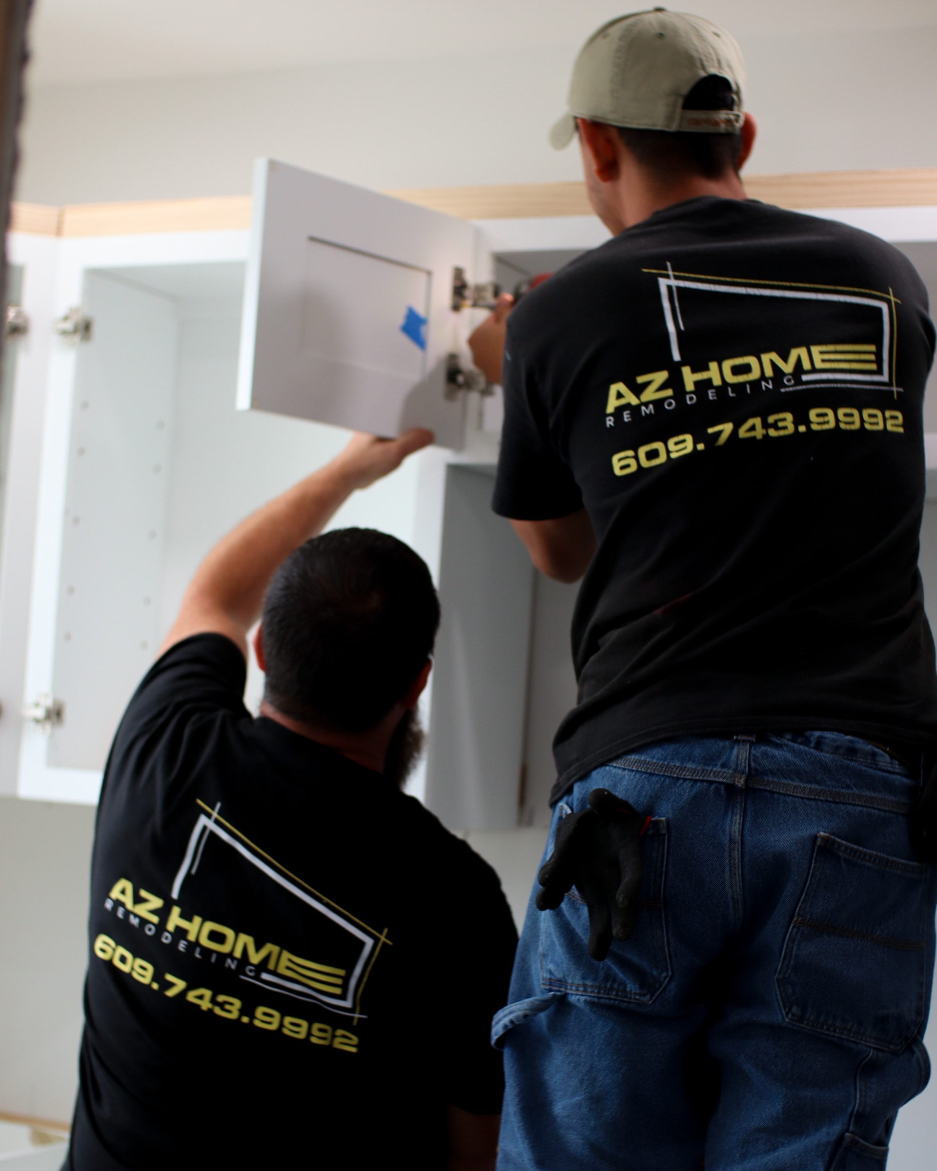 The AZ Home Remodeling crew installing cabinetry on a South Jersey job site