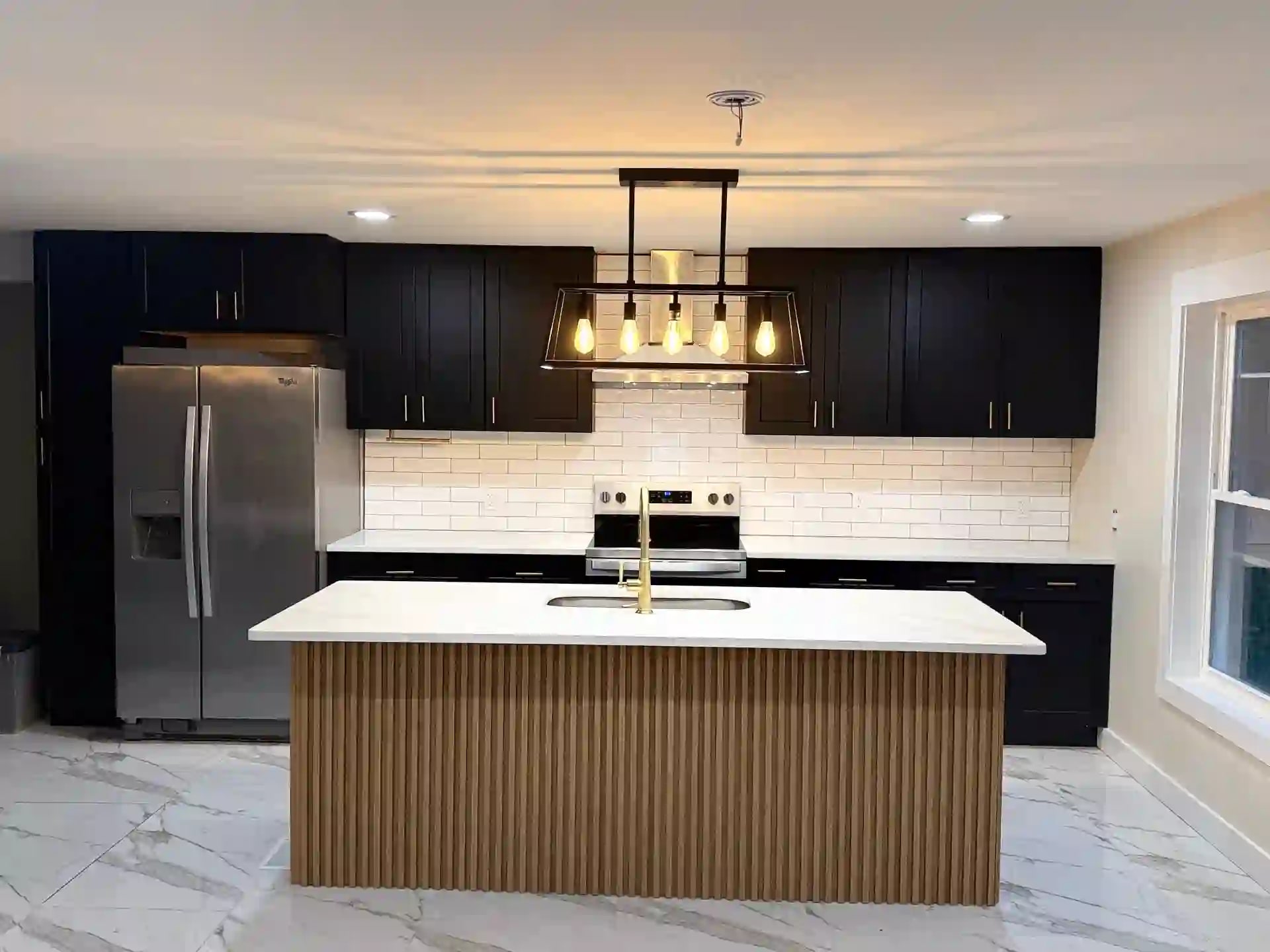 Remodeled kitchen with dark cabinetry and a fluted wood island, AZ Home Remodeling