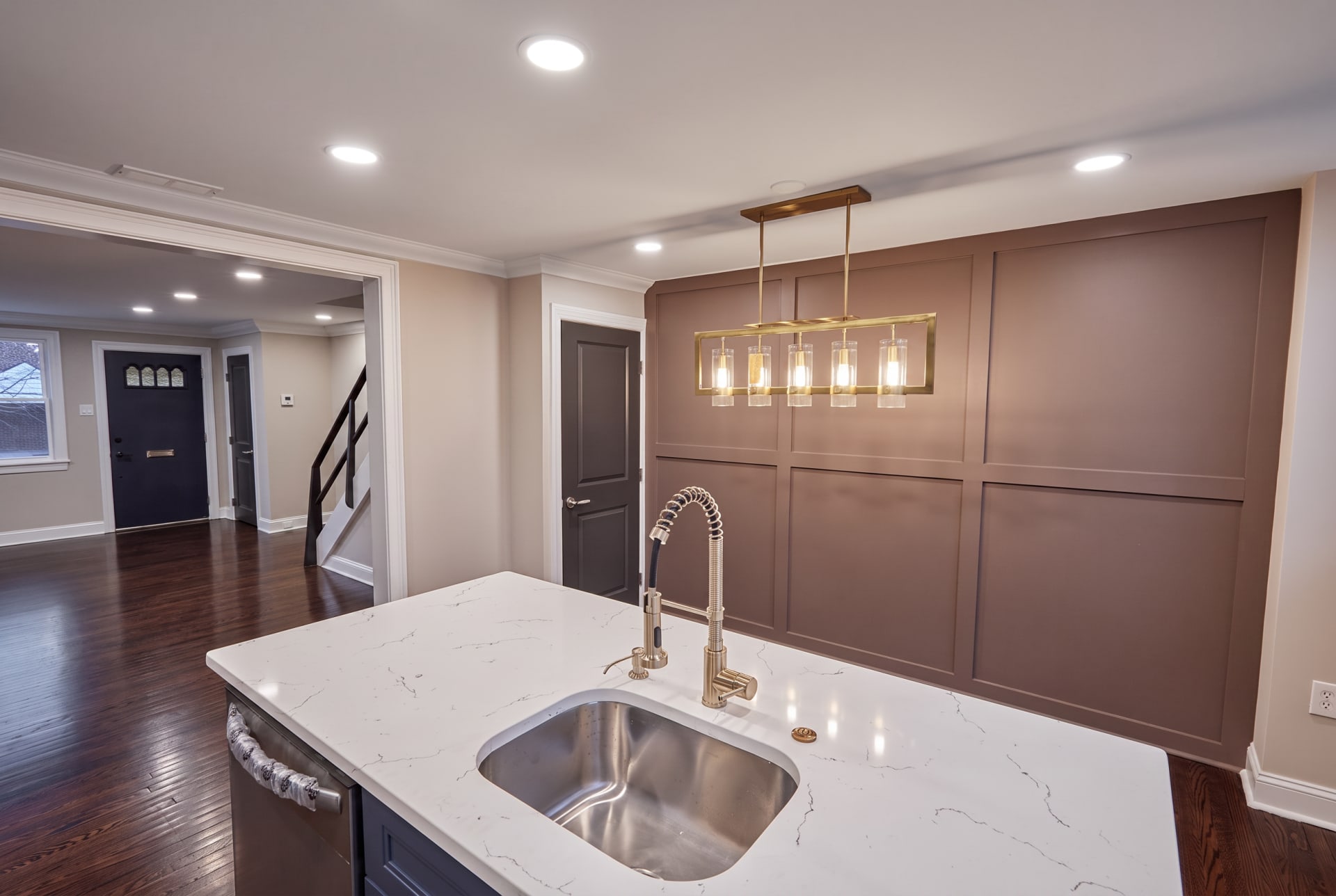 Navy kitchen island with a paneled accent wall, AZ Home Remodeling