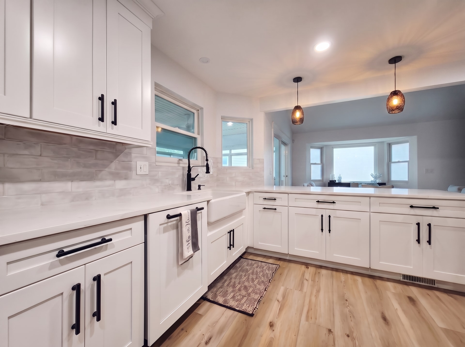 Bright white open-concept kitchen flowing into the great room, AZ Home Remodeling