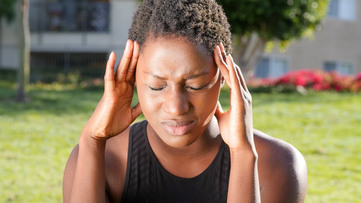 Woman with headache — Panadol Extra