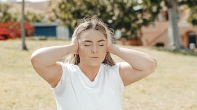 Woman holding her head — headache