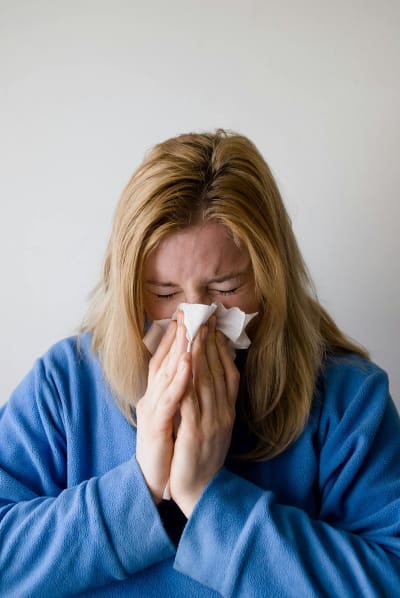 Sick woman wiping nose — cough