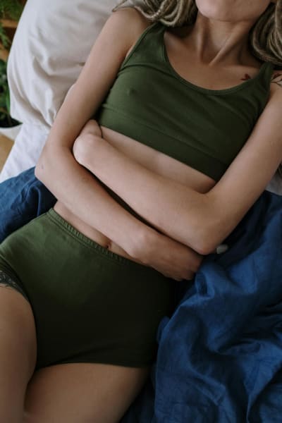 Woman with stomach pain — constipation