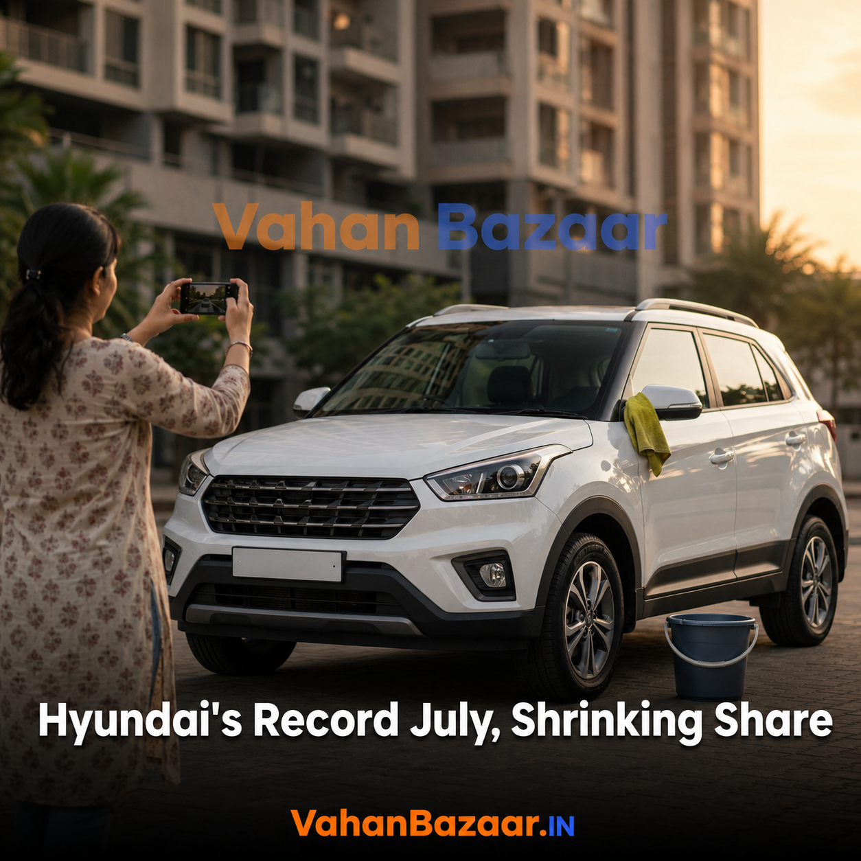 A used compact SUV parked outside an Indian apartment block while its owner photographs it for a listing