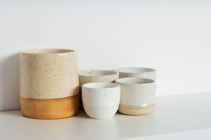 A beautiful assortment of handcrafted ceramic pottery and home decor in warm earth tones