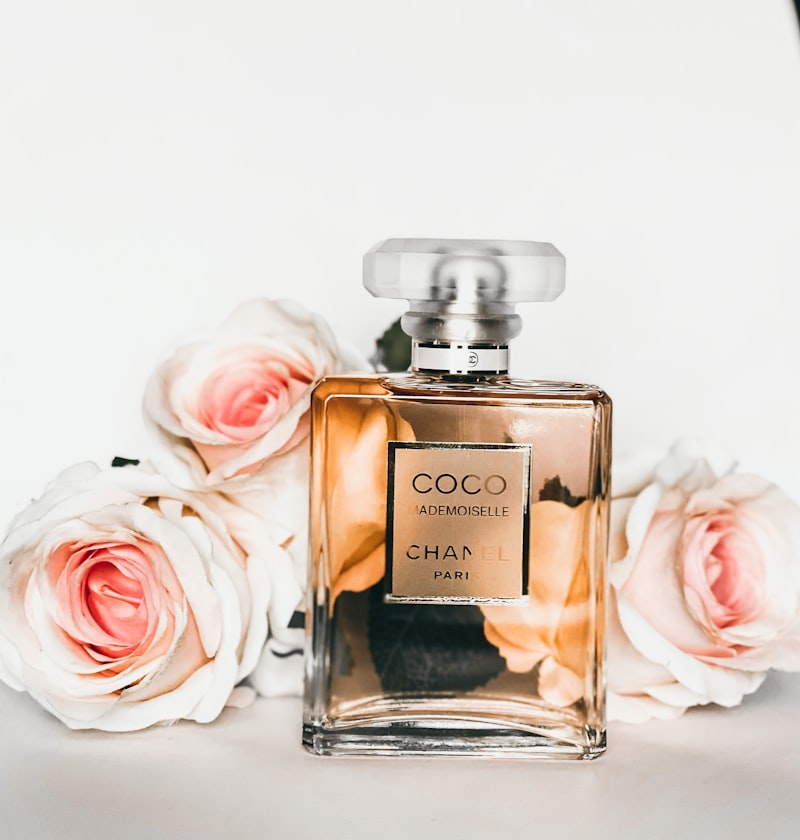 Premium Aromapassions clean fragrance bottles surrounded by natural floral and herbal ingredients