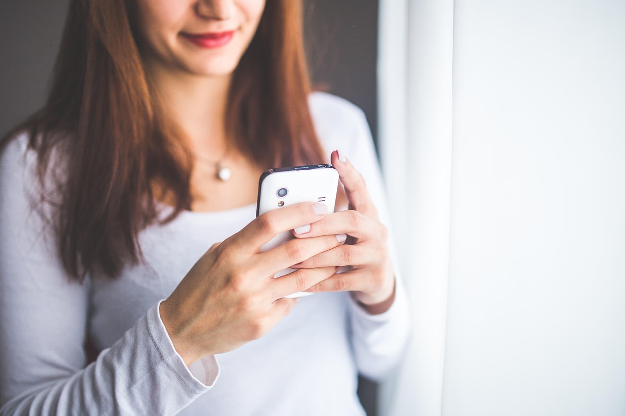 Woman holding a smartphone
