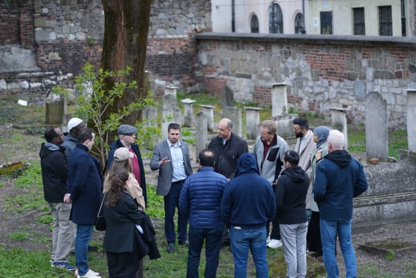Delegation touring a Jewish cemetery in Krakow
