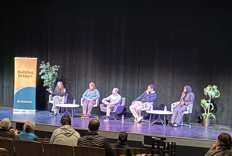 Building Bridges panel discussion on stage before an audience