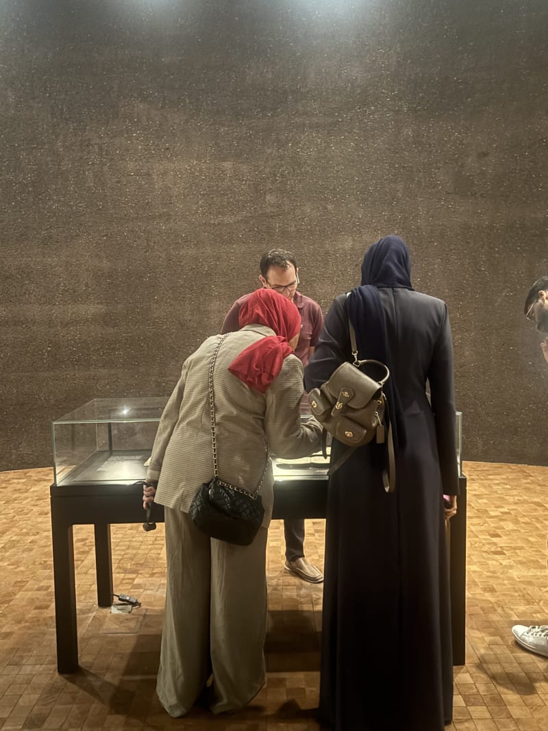 Delegation members viewing a museum display