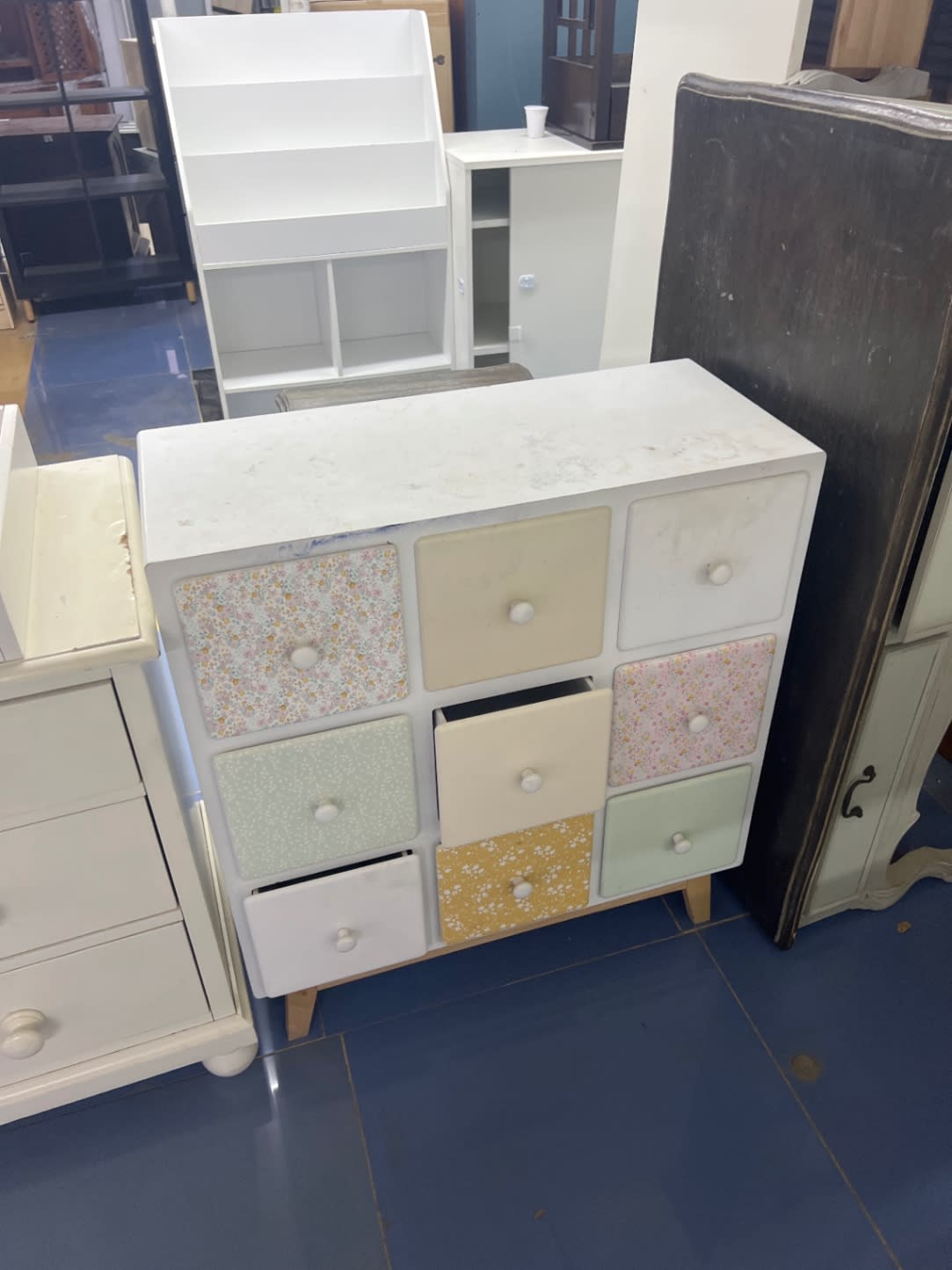 Second front angle of used white 9-drawer storage chest with multicolor floral drawers Bufaisal