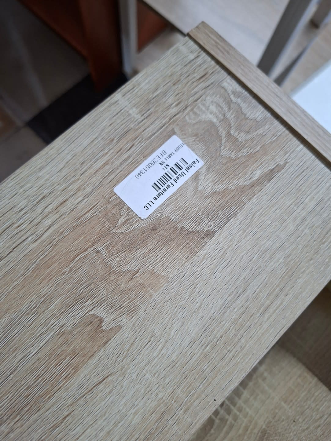 Bufaisal barcode label BFE26051340 on used study desk at Shop E Ajman