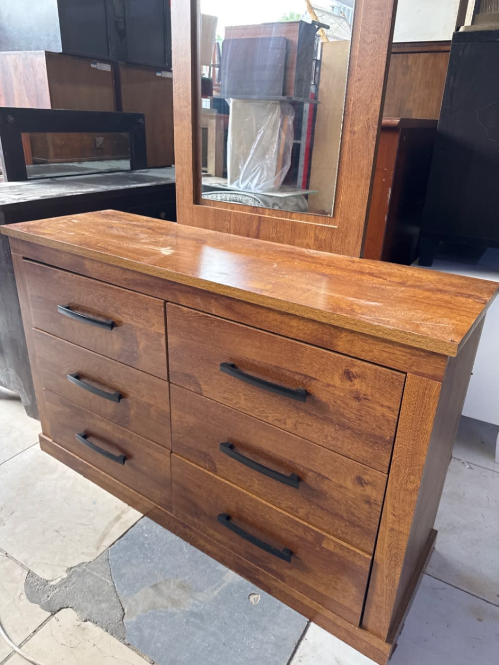 Front angle of used brown wood 6-drawer dresser with mirror at Bufaisal Shop B Ajman
