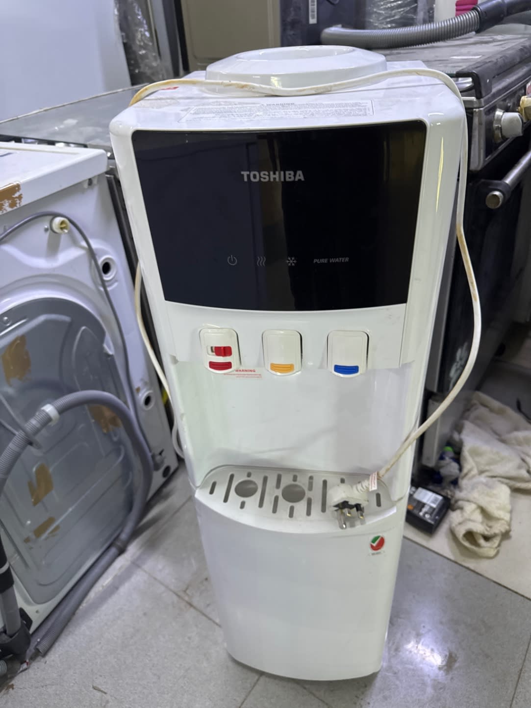 Front view of used Toshiba 3-tap water dispenser in good condition at Bufaisal Shop B Ajman