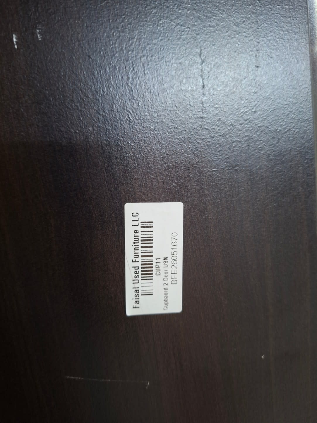 Bufaisal barcode label BFE26051670 for used 2-door wardrobe at Shop E Ajman
