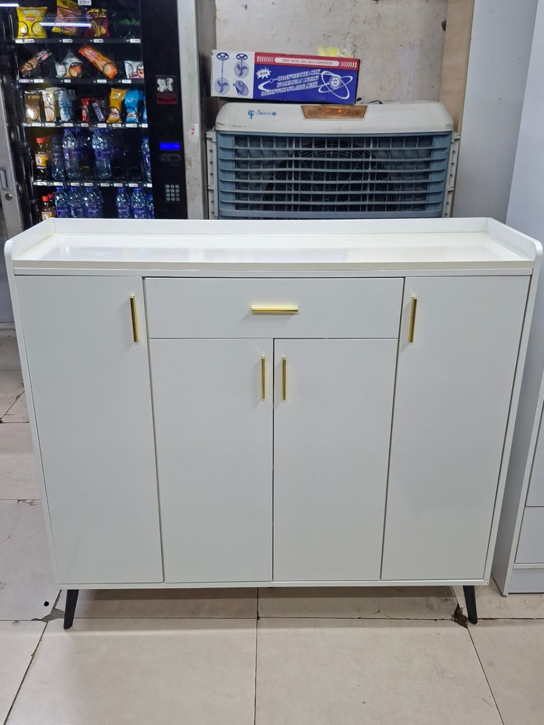 Bufaisal barcode label for used white shoe cabinet at Shop A Ajman