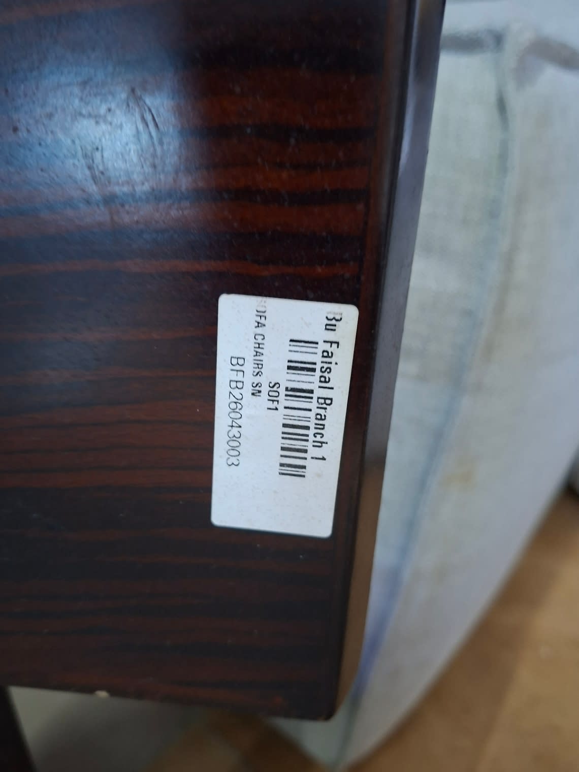 Bufaisal barcode label BFB26043003 for used upholstered dining chair at Shop C Ajman