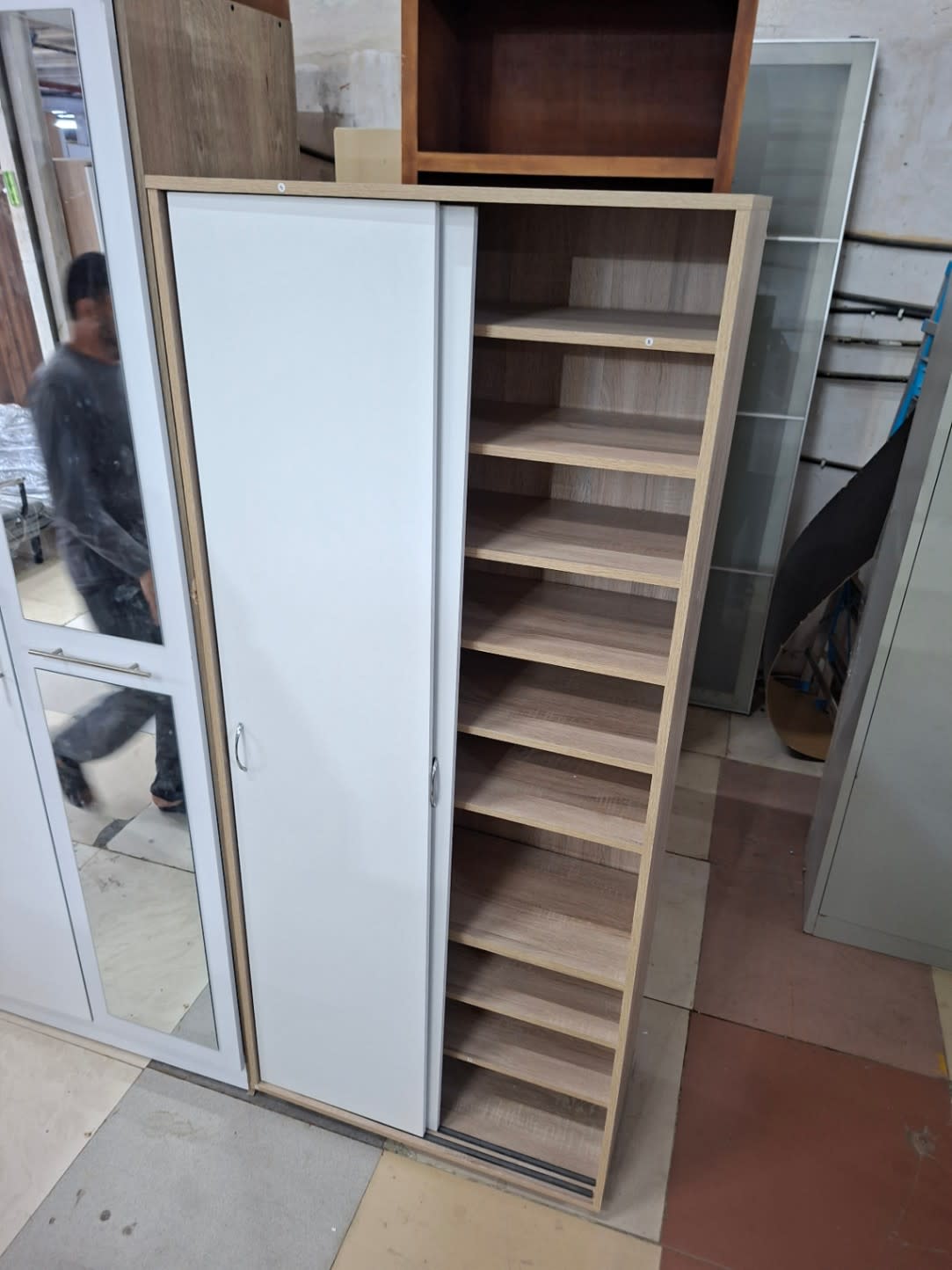 Used large shoe cabinet with sliding doors, angled view showing full shelving unit at Bufaisal Shop A Ajman