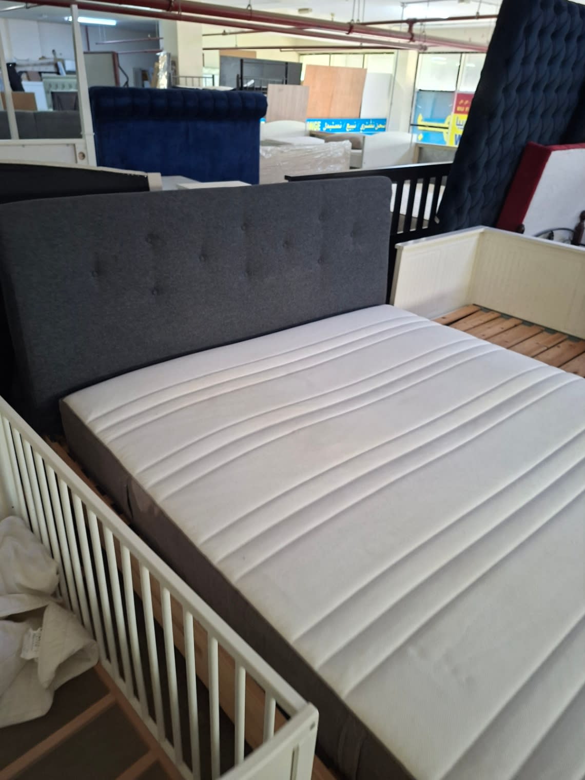 Used king bed frame with mattress at Bufaisal Shop C Ajman, barcode label not readable