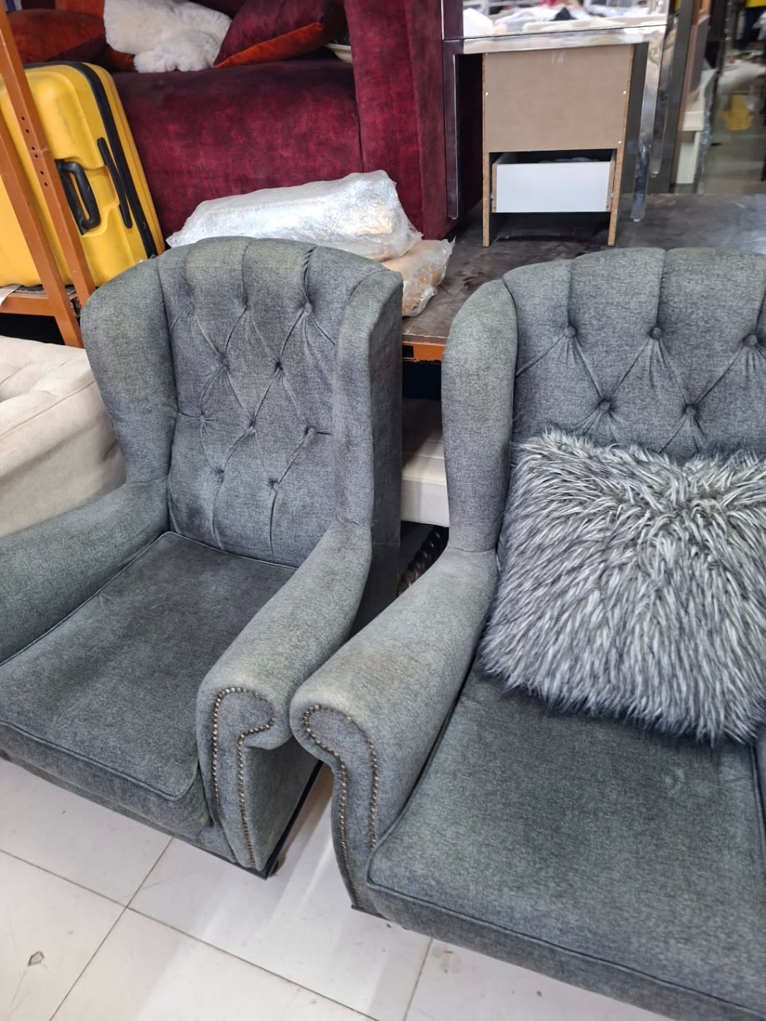 Barcode label photo for used grey wingback armchair pair at Bufaisal Ajman
