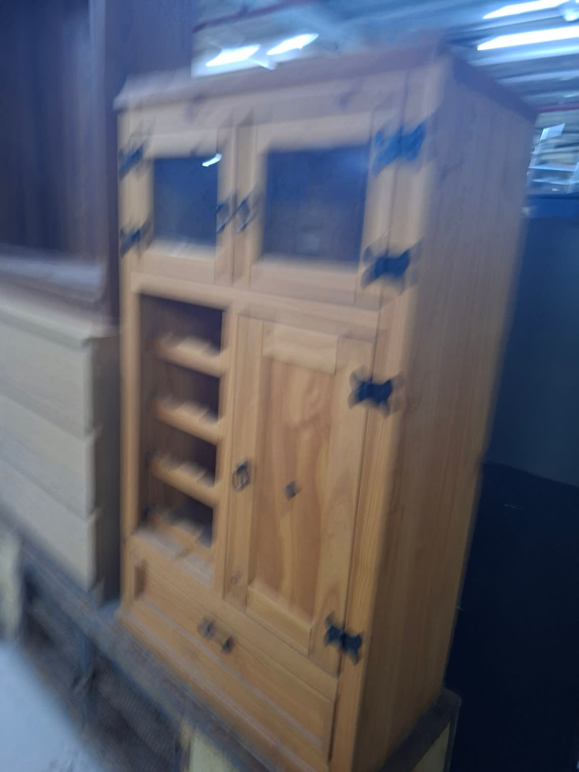 Side angle view of used pine wood bar cabinet with wine rack at Bufaisal Ajman
