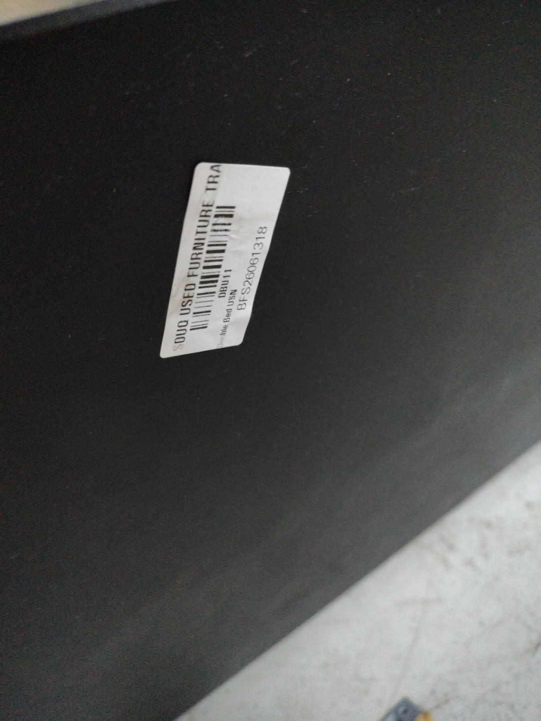 Bufaisal barcode label BFS26061318 for used double bed frame at Shop C Ajman