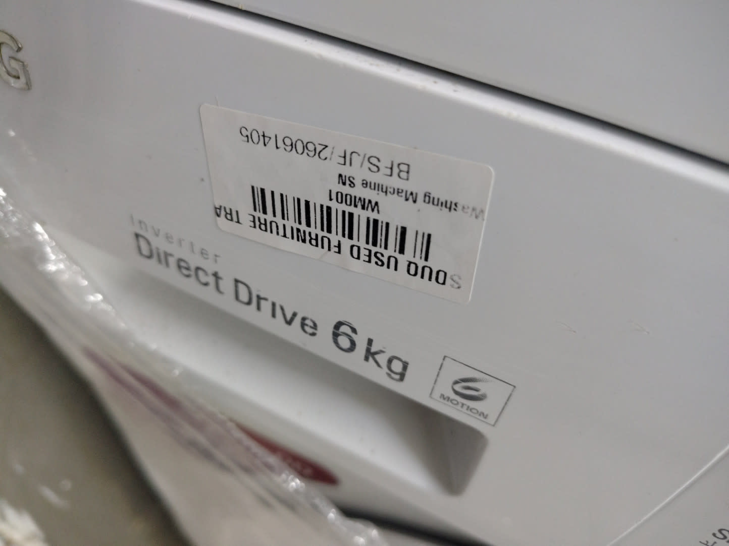 Bufaisal barcode label BFS/JF/26061405 on used LG 6kg front-load washing machine
