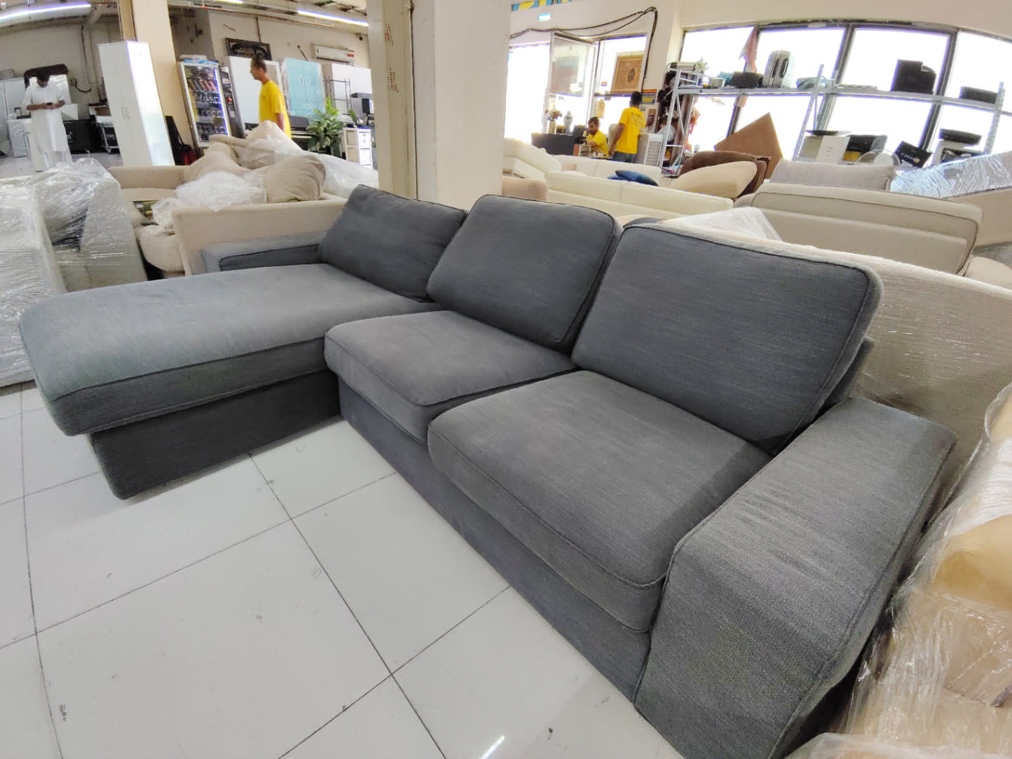 Used L-shape sectional sofa dark grey displayed at Bufaisal Shop C Ajman